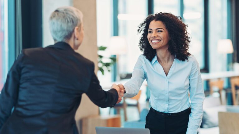 financial advisor shaking hands with client