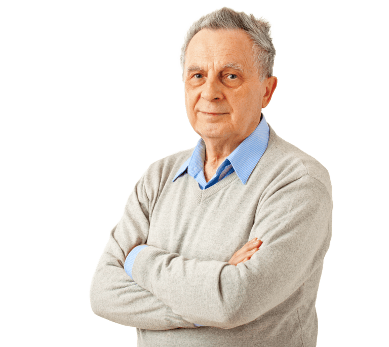 Senior man in beige sweater and blue dress shrit with arms crossed.