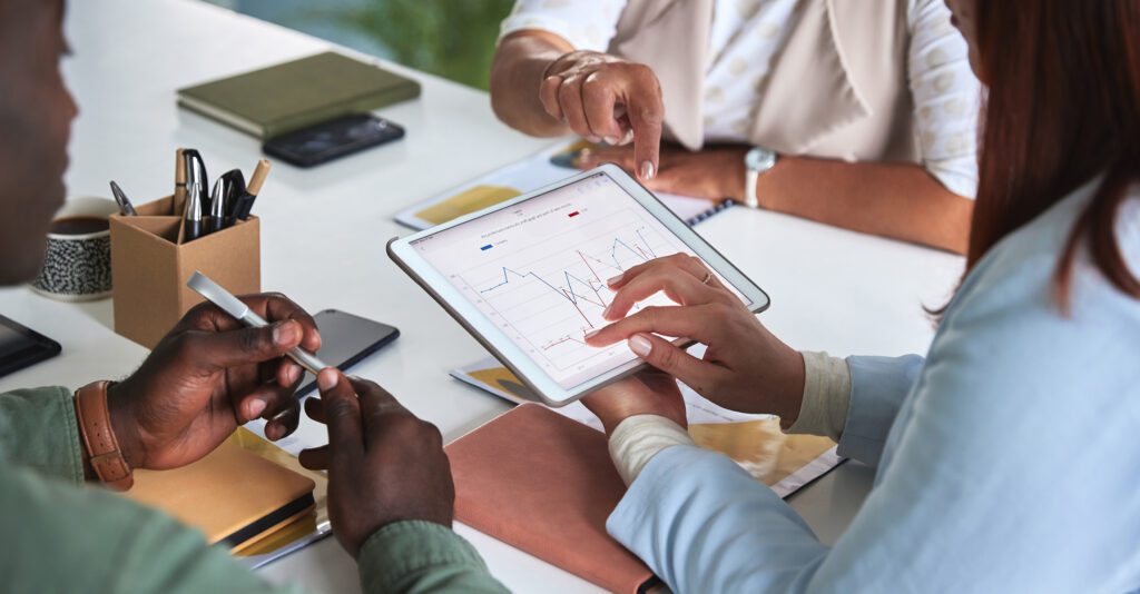 woman using ipad to look at data