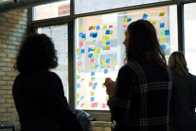 Vijay and Sara having a conversation in the office