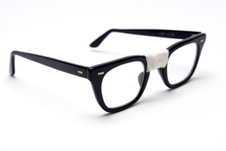 glasses with tape holding them together
