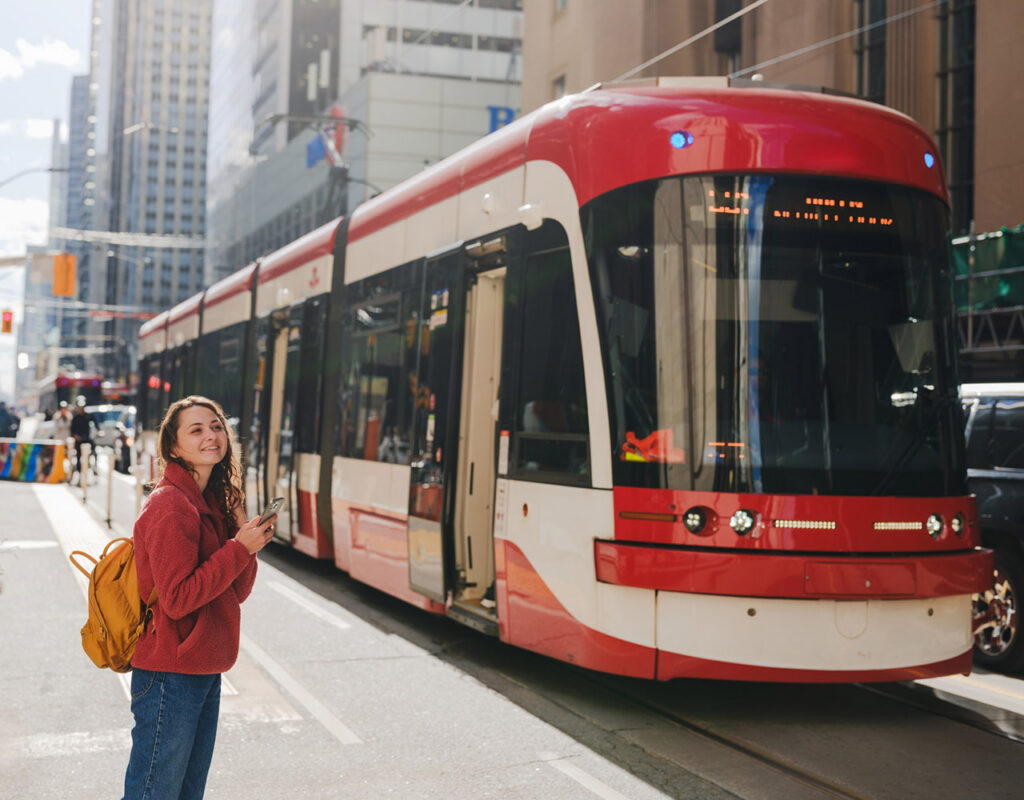 woman smiling by toronto street car