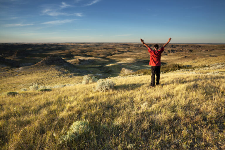 Hiker in Saskatchewan Grasslands Landscape