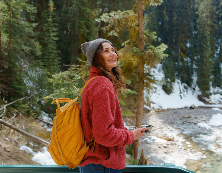 woman smiling in the woods
