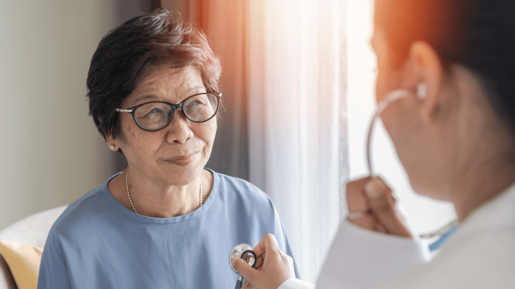 Healthy elderly patient with medical health checkup with cardiologist or geriatric doctor. Senior old aging woman with coronary artery heart disease or cardiac illness check-up in clinic