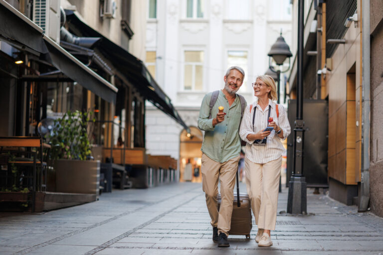 Mature couple exploring a city on vacation